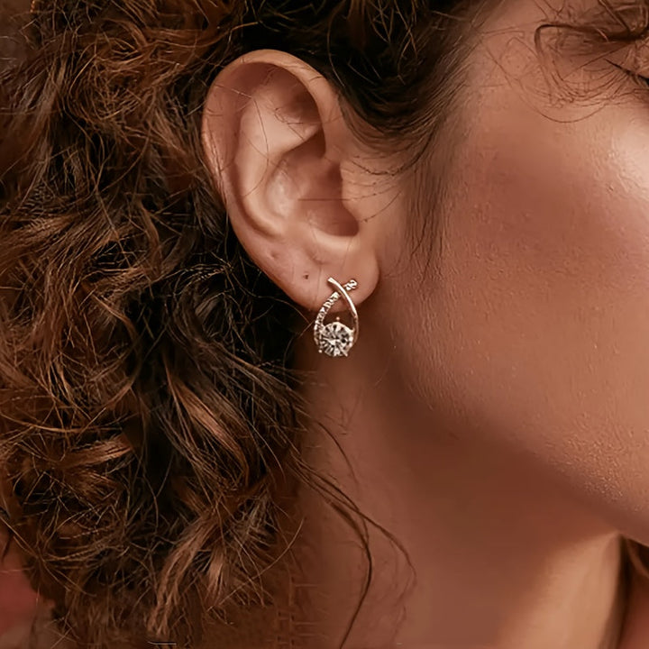 Örhängen med guldkors och zirconium