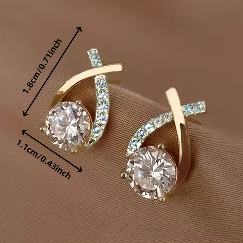 Örhängen med guldkors och zirconium