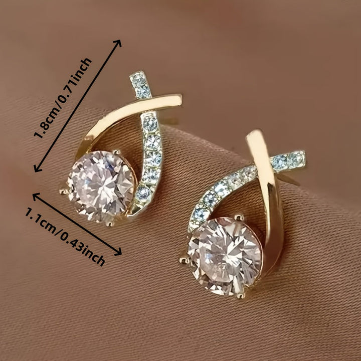 Örhängen med guldkors och zirconium