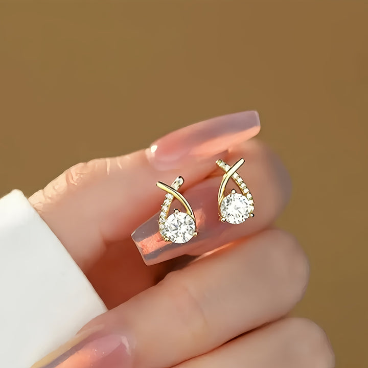 Örhängen med guldkors och zirconium