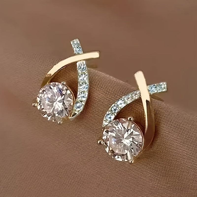 Örhängen med guldkors och zirconium