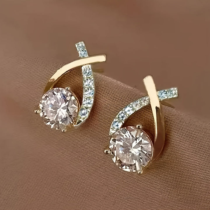Örhängen med guldkors och zirconium